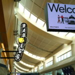 Digital billboard and illuminated blade sign for Bad Egg restaurant inside San Jose airport