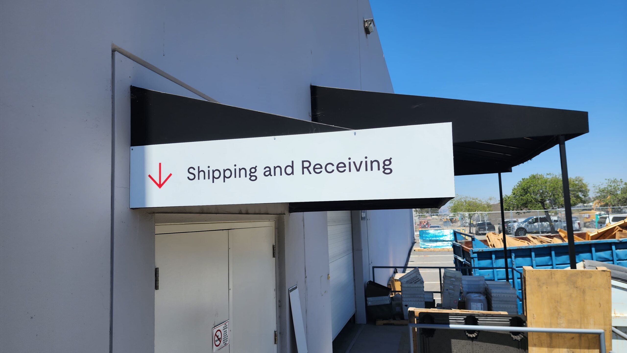 Directional wall sign for shipping and receiving area in San Jose, CA