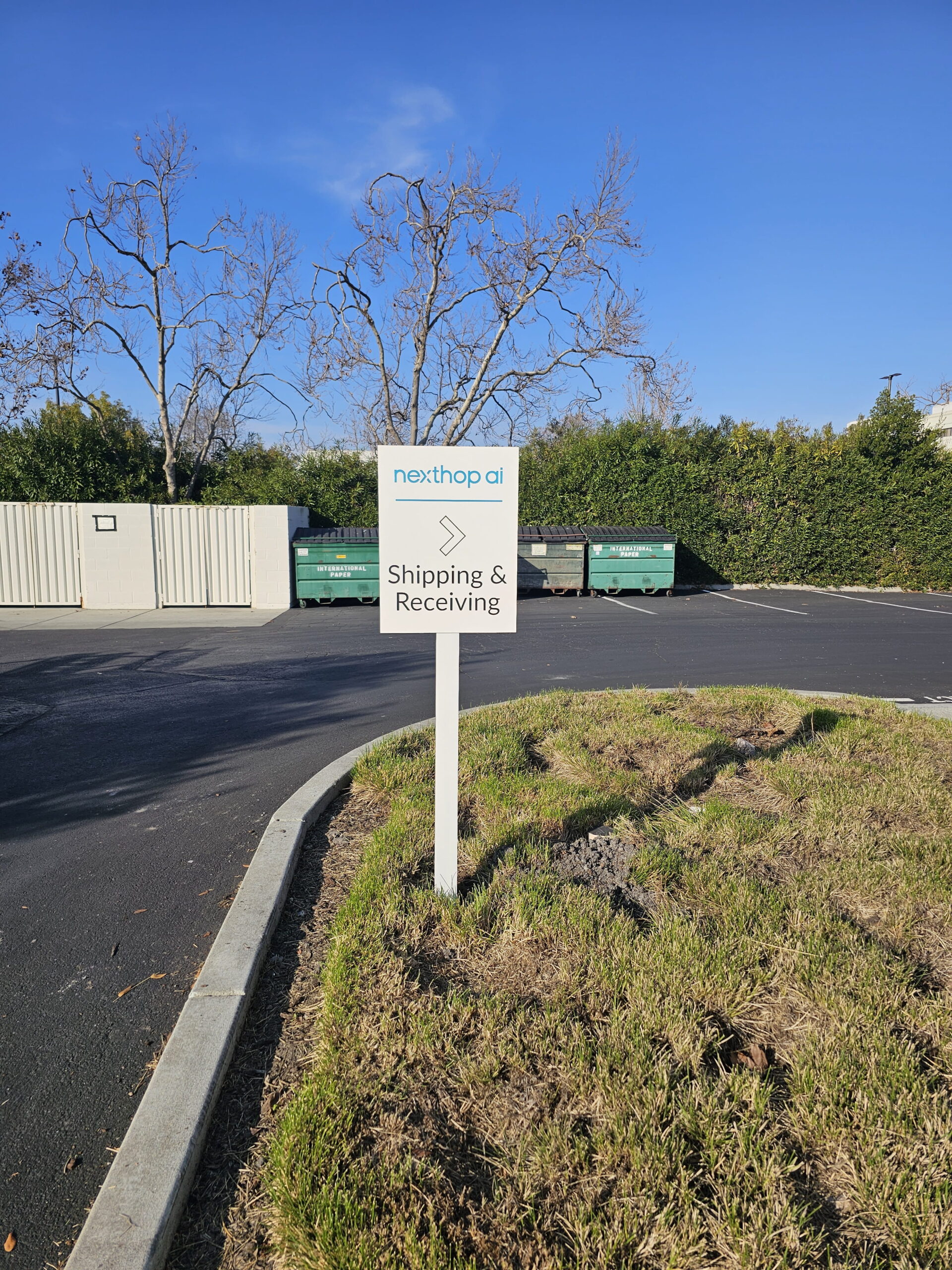 nexthop ai directional post sign for shipping and receiving in San Jose, CA