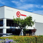 UL Solutions red channel letter building sign on office facade in San Jose, CA