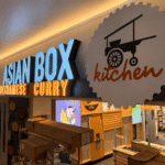 Asian Box channel letter building sign with Vietnamese curry text at San Jose airport