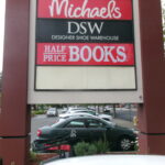 Pylon sign with Michaels, DSW, and Half Price Books logos in San Jose, CA