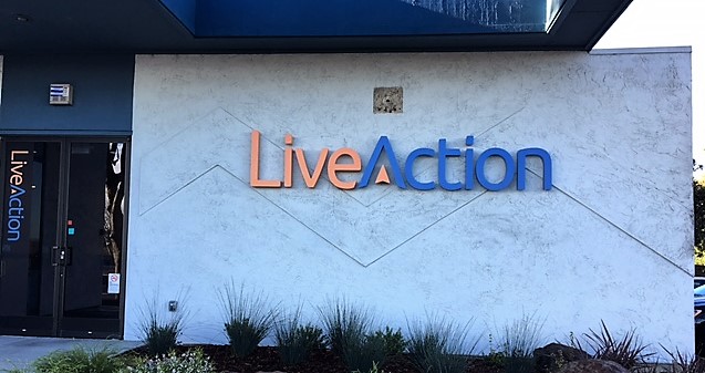 Custom-made exterior building sign - Live Action